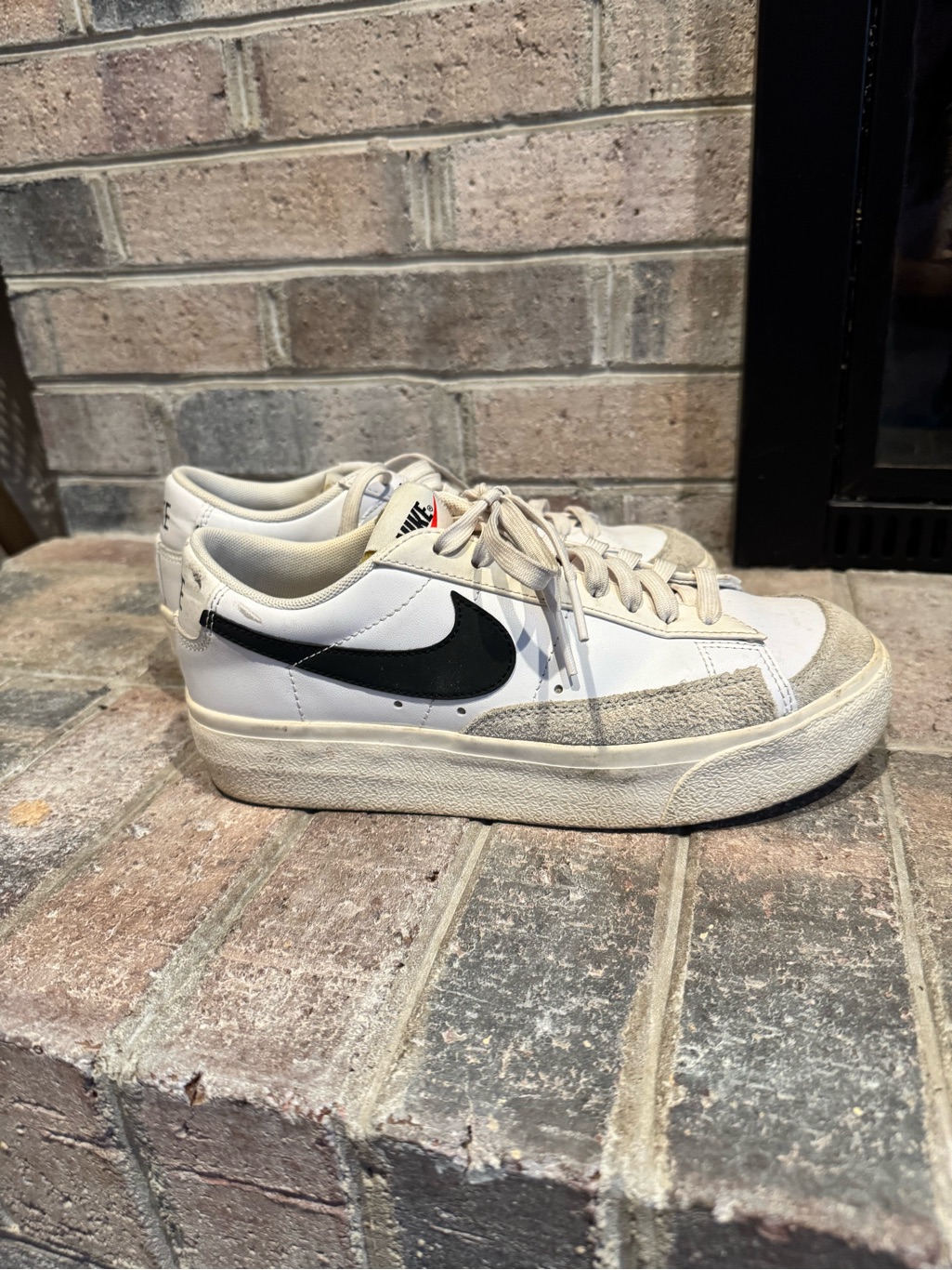 Nike White Low-Top Sneakers With Black Swoosh And Cream Accents